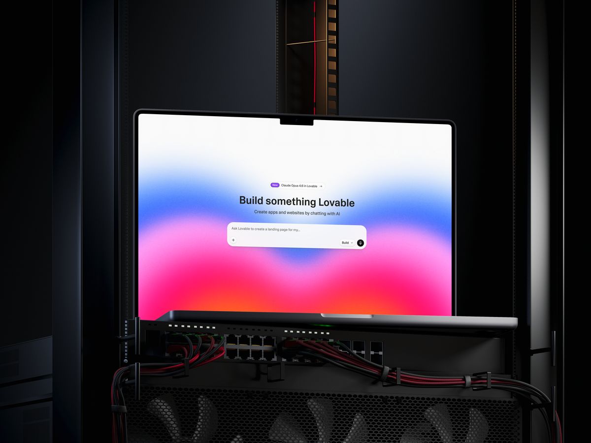 Lovable's Build something Lovable homepage on a MacBook mounted in a server rack